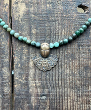 Load image into Gallery viewer, Egyptian Motif Scarab in Brass  with Emerald Beaded Necklace, 21” Long
